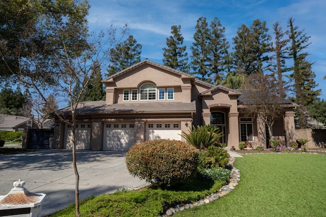 mediterranean / spanish home featuring driveway, an attached garage, stucco siding, a front lawn, and a tile roof