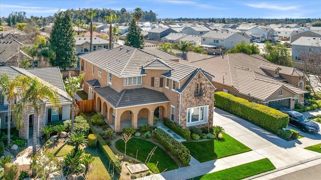 birds eye view of property with a residential view