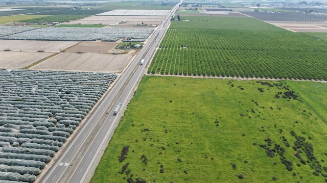 birds eye view of property with a rural view