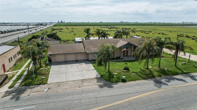 birds eye view of property with a rural view