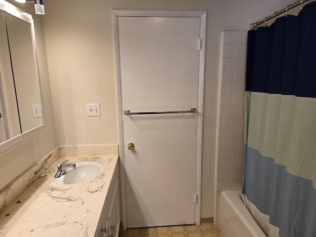 bathroom with shower / bath combo with shower curtain and vanity