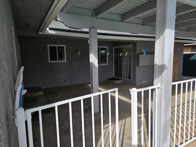 view of exterior entry with stucco siding