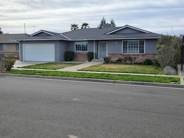 single story home with a shingled roof, a front lawn, concrete driveway, a garage, and brick siding