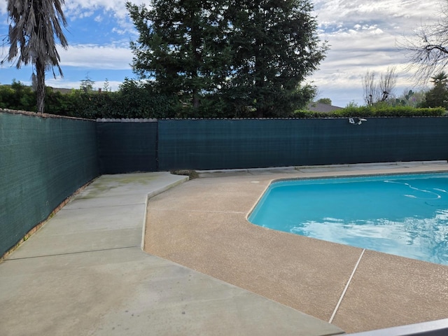 view of pool featuring a fenced in pool, a patio, and a fenced backyard