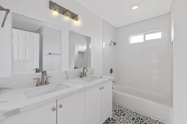 full bathroom with a sink, bathing tub / shower combination, double vanity, and tile patterned flooring