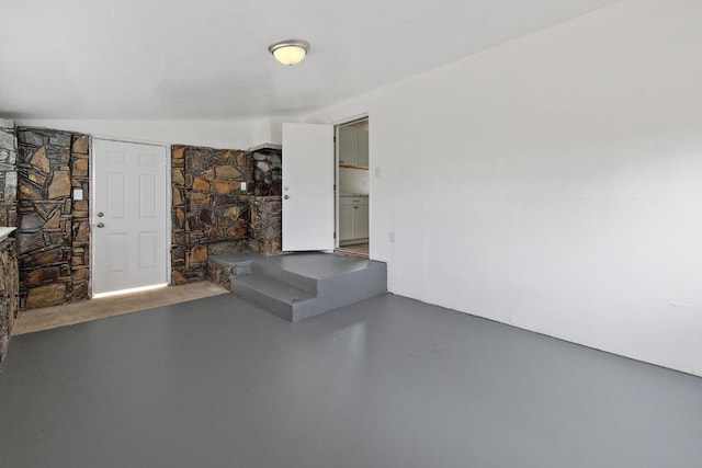 unfurnished living room with concrete floors