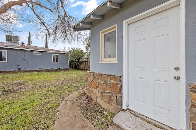 3823 E Clinton Ave, Fresno, CA 93703 - property entrance with stucco siding and a yard