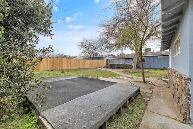 view of yard featuring a patio area and fence