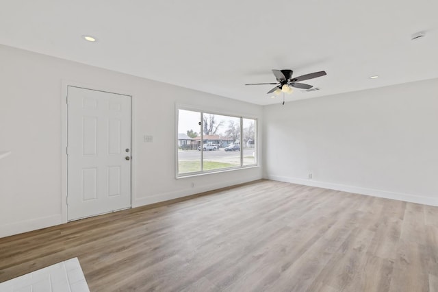 unfurnished living room with visible vents, baseboards, ceiling fan, recessed lighting, and light wood-style floors