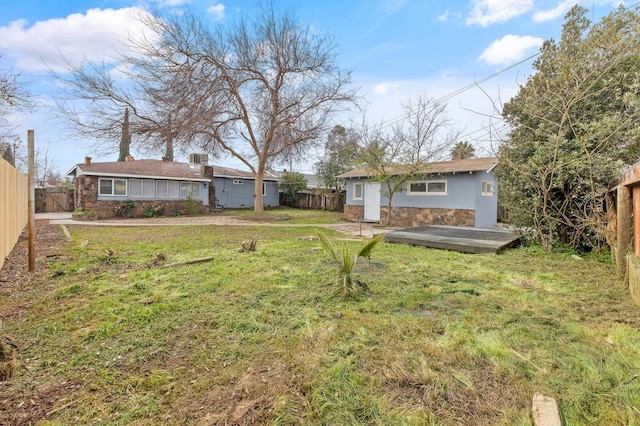 view of yard featuring an outbuilding and a fenced backyard