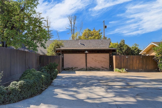 exterior space with fence and driveway