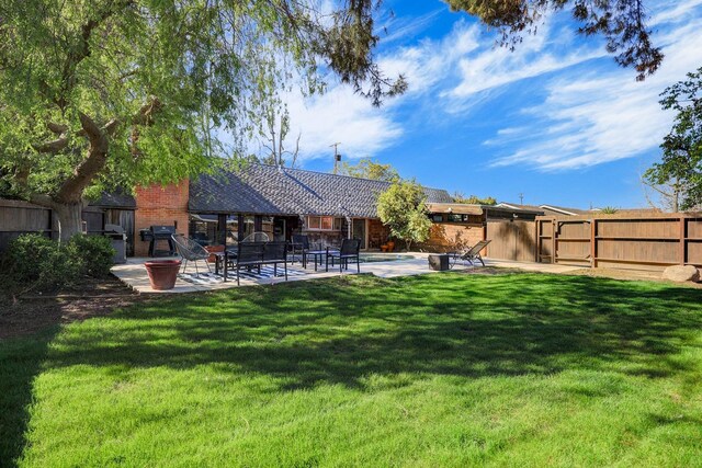 view of yard featuring a patio and fence