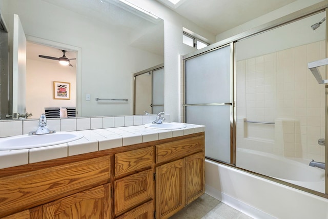 8153 N Cedar Ave Unit 106, Fresno, CA 93720 - full bathroom featuring a ceiling fan, double vanity, combined bath / shower with glass door, and tile patterned flooring