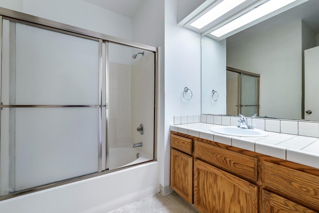 8153 N Cedar Ave Unit 106, Fresno, CA 93720 - bathroom featuring enclosed tub / shower combo, vanity, and tile patterned floors