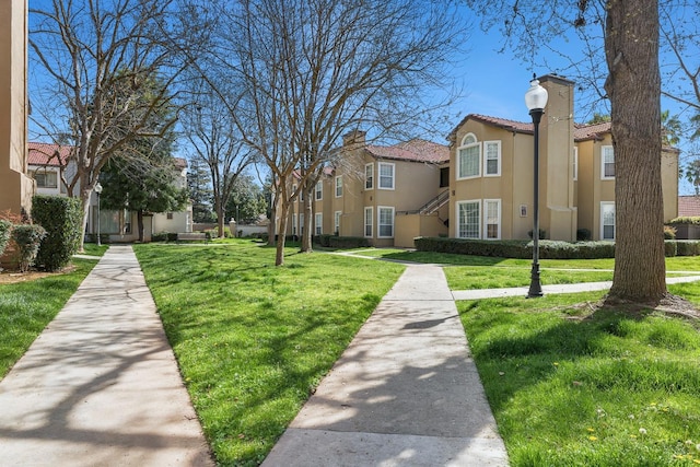 8153 N Cedar Ave Unit 106, Fresno, CA 93720 - view of home's community featuring a yard and a residential view