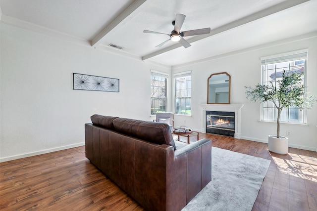 8153 N Cedar Ave Unit 106, Fresno, CA 93720 - living room with hardwood / wood-style flooring, beamed ceiling, a ceiling fan, a glass covered fireplace, and baseboards
