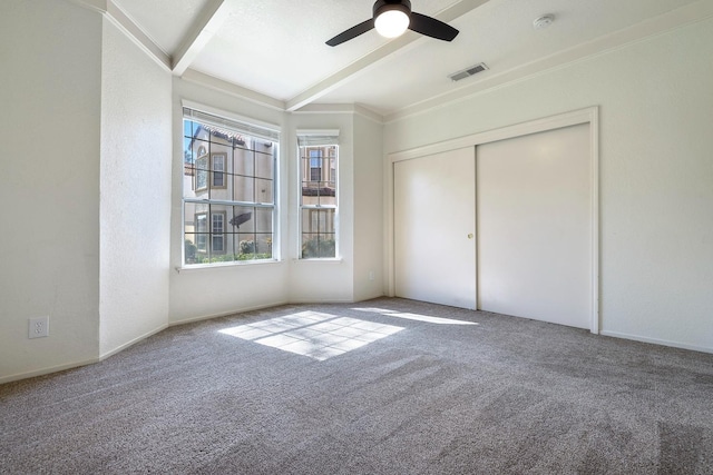 8153 N Cedar Ave Unit 106, Fresno, CA 93720 - unfurnished bedroom with beam ceiling, carpet flooring, a ceiling fan, and a closet