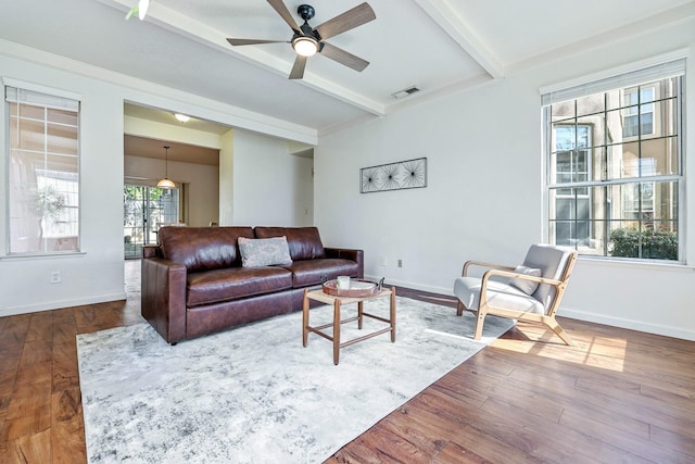 8153 N Cedar Ave Unit 106, Fresno, CA 93720 - living area with beam ceiling, ceiling fan, baseboards, and wood finished floors