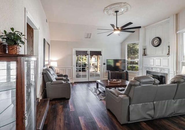26189 Valerie Ave, Madera, CA 93638 - living area featuring french doors, a ceiling fan, dark wood-style floors, a decorative wall, and lofted ceiling
