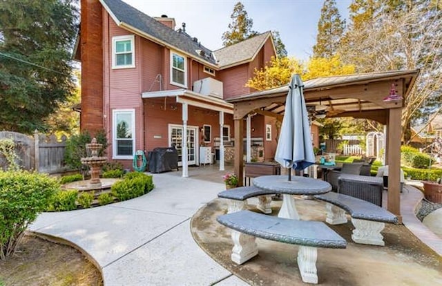 26189 Valerie Ave, Madera, CA 93638 - rear view of house with a patio area, a chimney, and a gazebo