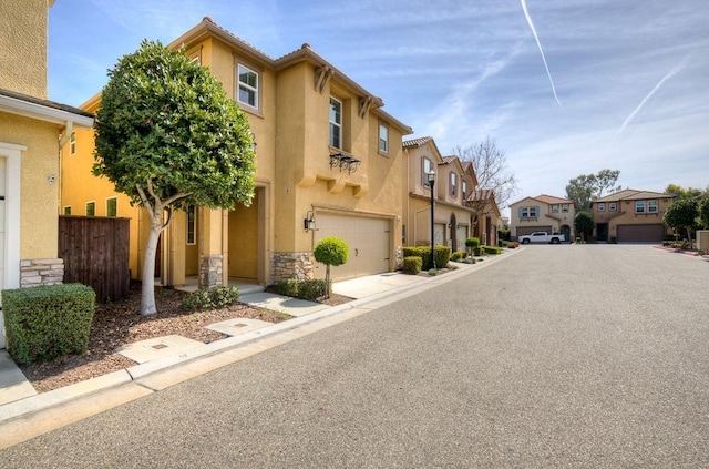 view of road with a residential view and curbs