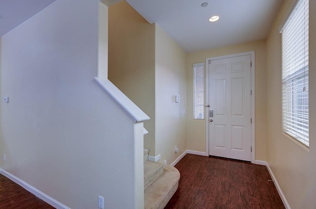 entrance foyer with stairway, recessed lighting, baseboards, and wood finished floors