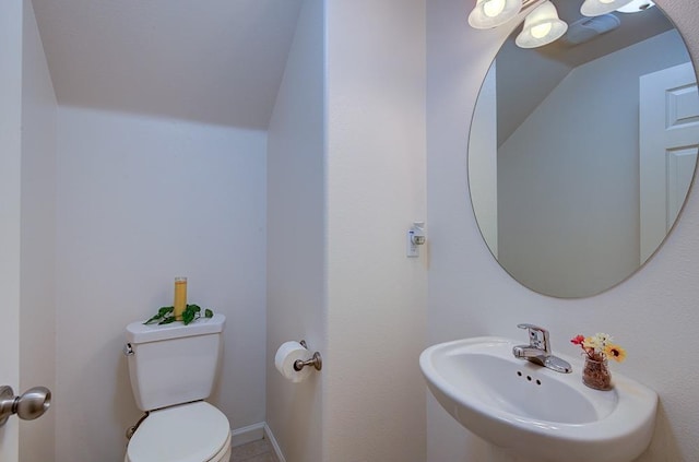 bathroom featuring toilet and a sink