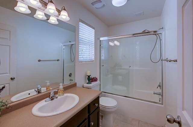 full bathroom with tile patterned flooring, toilet, vanity, and visible vents