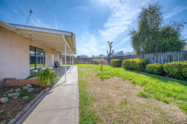 view of yard featuring a patio and a fenced backyard