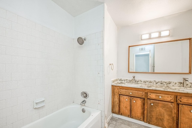 full bath with double vanity, visible vents, bathing tub / shower combination, and a sink