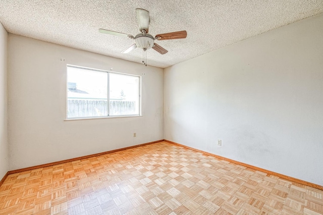 unfurnished room with baseboards, a textured ceiling, and ceiling fan