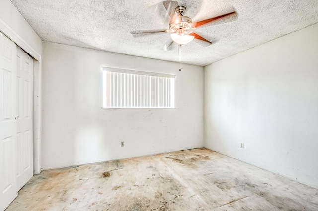 unfurnished bedroom with a closet, a textured ceiling, and a ceiling fan