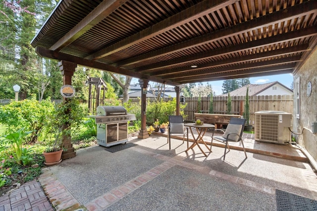 view of patio / terrace with area for grilling, central AC unit, and fence