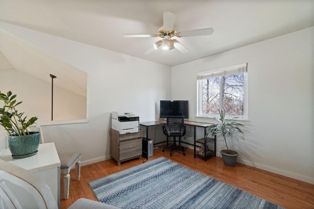 office area featuring baseboards, wood finished floors, and a ceiling fan