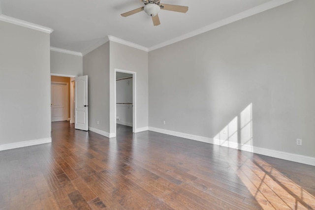 interior space with crown molding, dark wood-style floors, baseboards, and ceiling fan