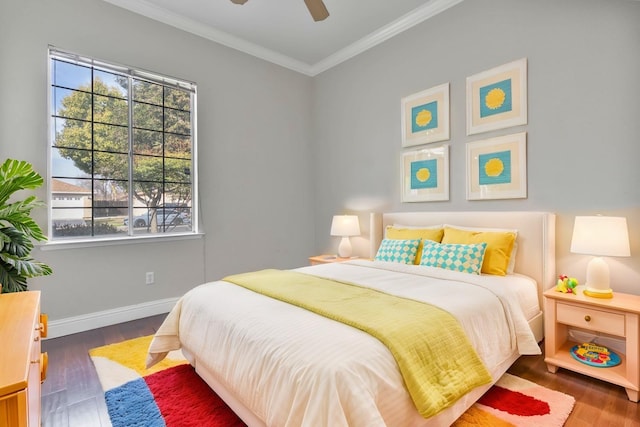 bedroom with crown molding, wood finished floors, baseboards, and ceiling fan