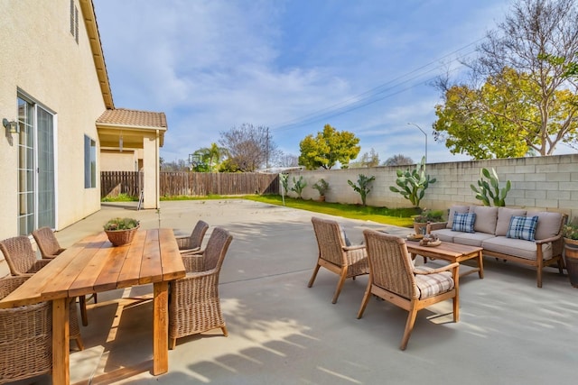 view of patio / terrace featuring a fenced backyard, outdoor lounge area, and outdoor dining space