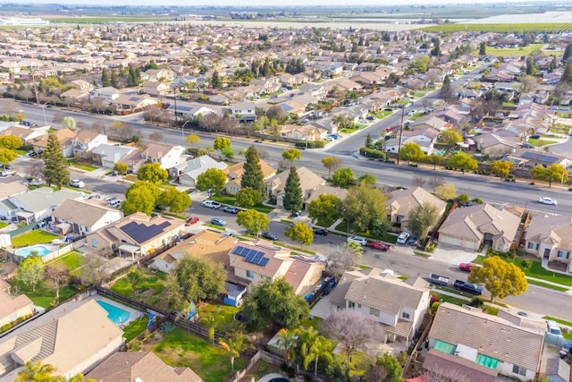 birds eye view of property with a residential view