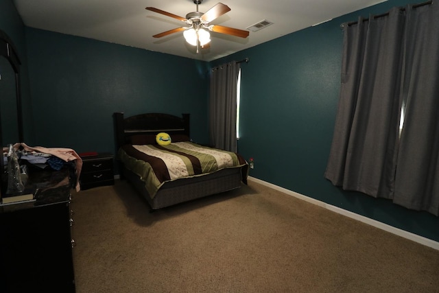 bedroom featuring visible vents, ceiling fan, baseboards, and carpet floors