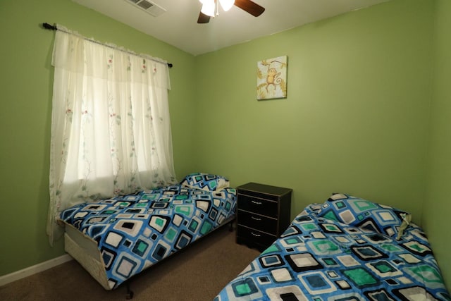 bedroom featuring a ceiling fan, carpet, visible vents, and baseboards