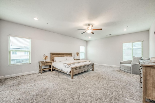 carpeted bedroom with recessed lighting, visible vents, baseboards, and ceiling fan