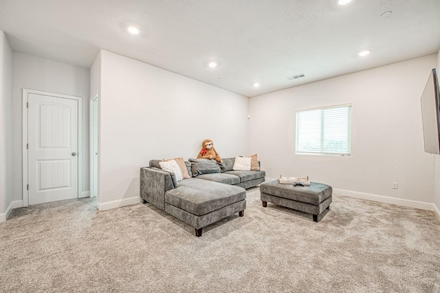 carpeted living room featuring recessed lighting, visible vents, and baseboards