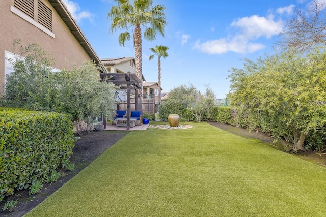 view of yard featuring a patio, a fenced backyard, a pergola, and an outdoor hangout area