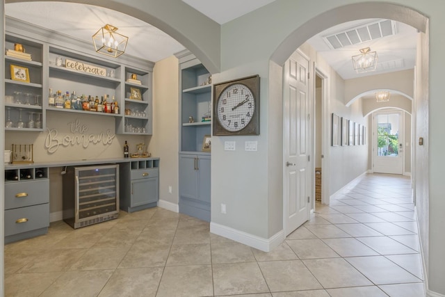 interior space featuring visible vents and wine cooler