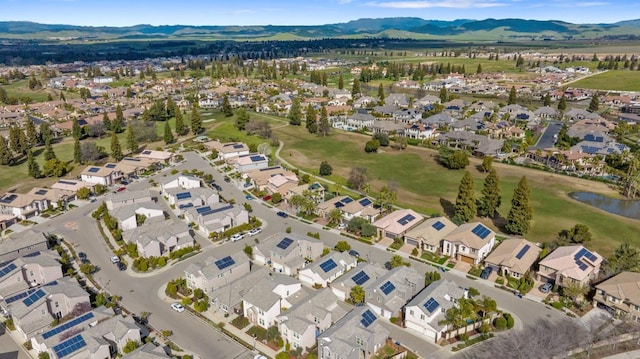 aerial view with a residential view and a water and mountain view