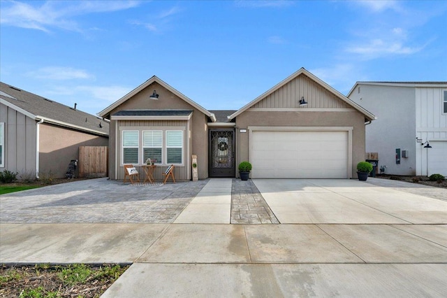 ranch-style house with concrete driveway and a garage