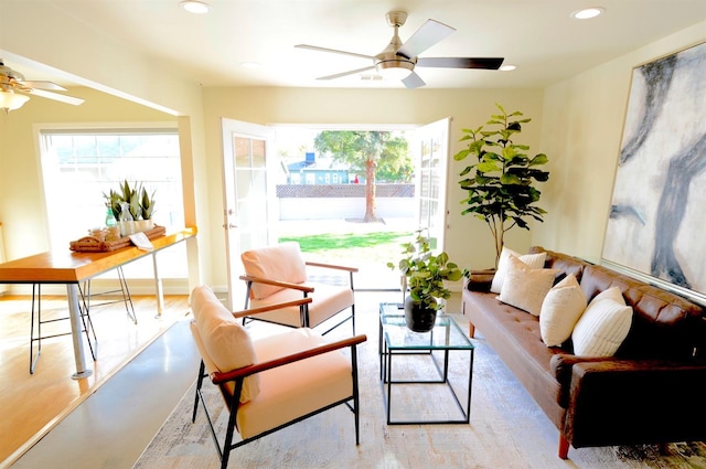 living room featuring a ceiling fan, plenty of natural light, and recessed lighting