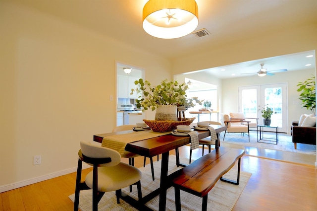 dining room featuring visible vents, recessed lighting, french doors, light wood finished floors, and baseboards