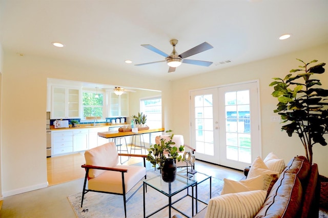 living room with recessed lighting, french doors, visible vents, and a ceiling fan