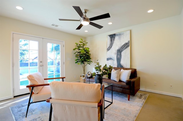 interior space with concrete flooring, recessed lighting, baseboards, and french doors